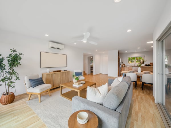 Bright and modern living space featuring an open layout, sleek furniture, and abundant natural light.
