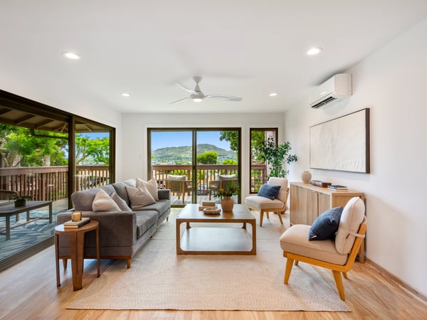 Bright and airy living space featuring modern decor and expansive views from large windows.