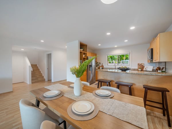 Bright and airy kitchen-dining area featuring modern finishes and ample space for gatherings.