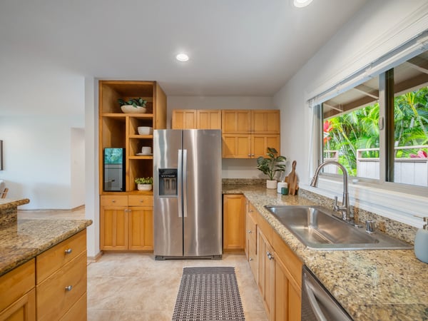 Modern kitchen featuring sleek stainless steel appliances, ample storage, and a bright, open layout.