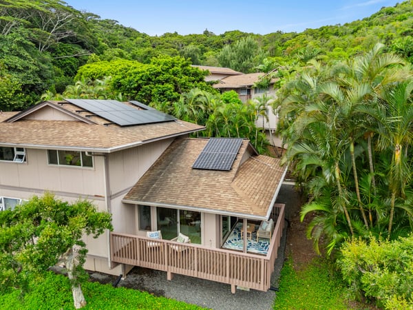 This home features solar panels and lush greenery, offering a unique blend of eco-friendliness and privacy.