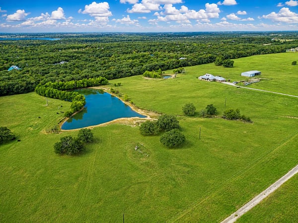 PROPERTY AERIAL...View Of Home And Lake
