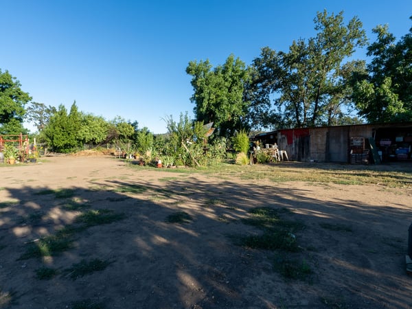 BACK YARD, FLAT USABLE AREA TO DEVELOP GARDEN OR WHAT EVER YOUR NEEDS ARE.