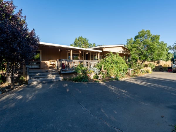 FRONT OF HOUSE WITH DECK