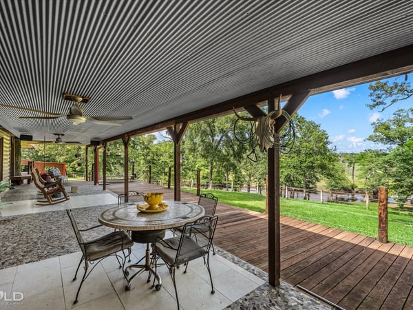 Spacious outdoor deck with panoramic views, perfect for entertaining or enjoying tranquil moments in nature.