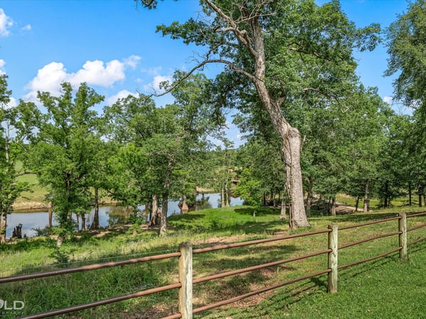 Scenic property featuring lush greenery and peaceful views of a tranquil river, ideal for nature enthusiasts.