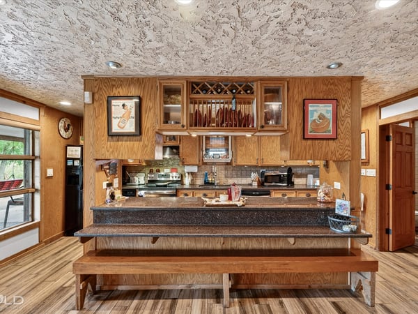 This inviting kitchen features ample counter space and a unique design, perfect for gatherings and culinary creativity.