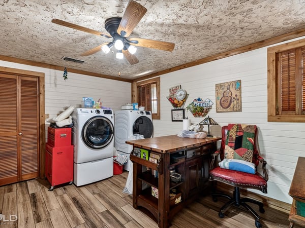 Bright laundry room features ample workspace for everyday tasks.