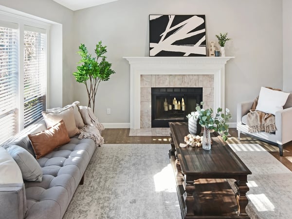 Bright living room featuring a cozy fireplace, and ample natural light throughout.