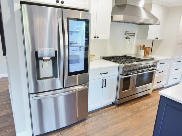 Modern kitchen featuring stainless steel appliances, ample storage, and a spacious layout for cooking and entertaining.