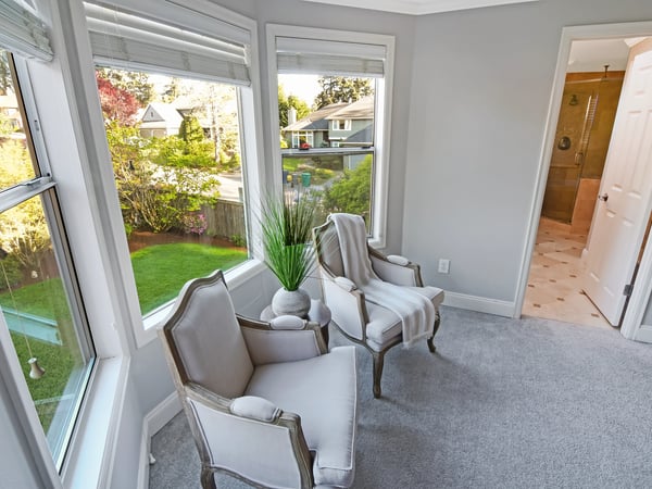 Bright and airy sunroom with large windows, offering a perfect spot for relaxation and views.