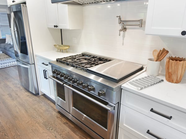 Modern kitchen equipped with high-end appliances and a spacious layout, perfect for culinary enthusiasts.