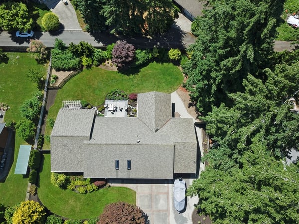Spacious home nestled amidst lush greenery, featuring expansive gardens and ample outdoor entertaining areas.