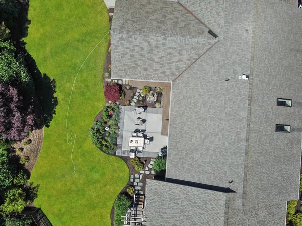 This property features a spacious outdoor patio and lush landscaping, ideal for entertaining or relaxing.