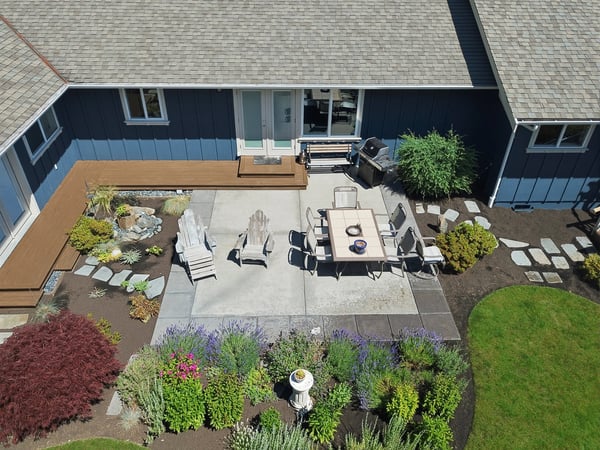 This inviting outdoor space features a spacious patio, vibrant landscaping, and a perfect area for entertaining.