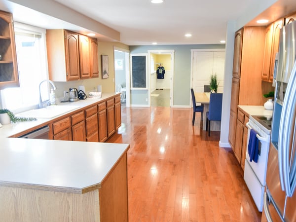 Spacious kitchen with ample cabinetry, open floor plan, and vibrant natural light throughout the living area.