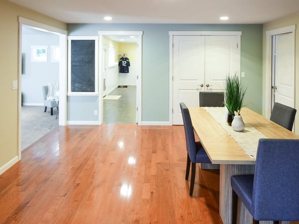 Bright and inviting open-concept dining area flows seamlessly into additional versatile living spaces.