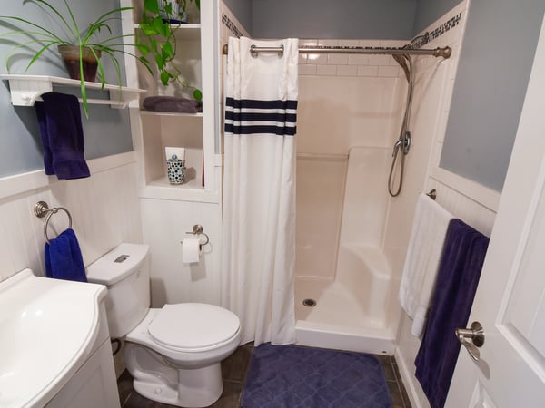 Bright and functional bathroom featuring modern fixtures, ample storage, and fresh color accents for a welcoming feel.