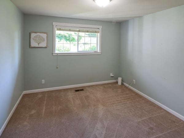 Bright and versatile space with natural light, ready for your personal touch in a peaceful setting.