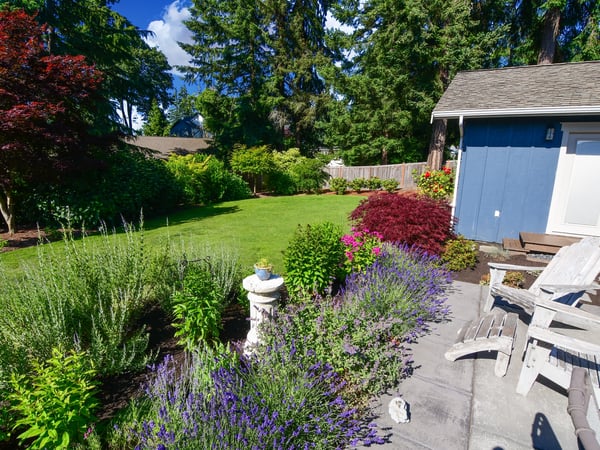 Discover a vibrant garden retreat with lush landscaping, perfect for outdoor relaxation and gatherings.