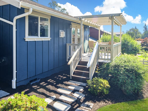 Discover this inviting home featuring a welcoming porch, landscaped yard, and abundant natural light.