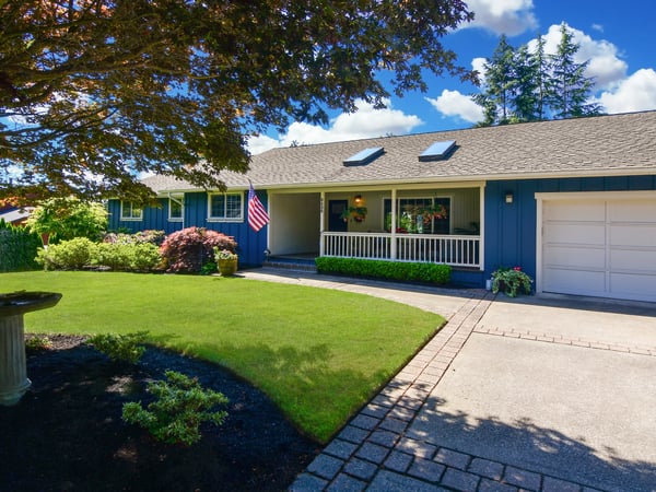 Inviting home with a beautifully landscaped yard, spacious entryway, and abundant natural light throughout.