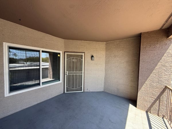 Large covered balcony offers a comfortable outdoor living space with room for seating and relaxation. Enjoy fresh air and private outdoor enjoyment in this desirable Phoenix condo.