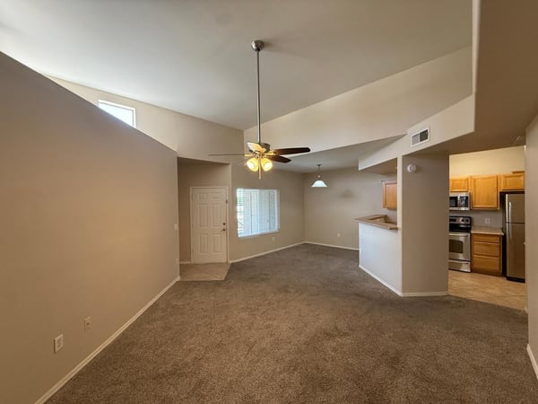 Impressive living space highlighted by vaulted ceilings and abundant natural light. The flexible layout accommodates a variety of furniture arrangements and lifestyles.