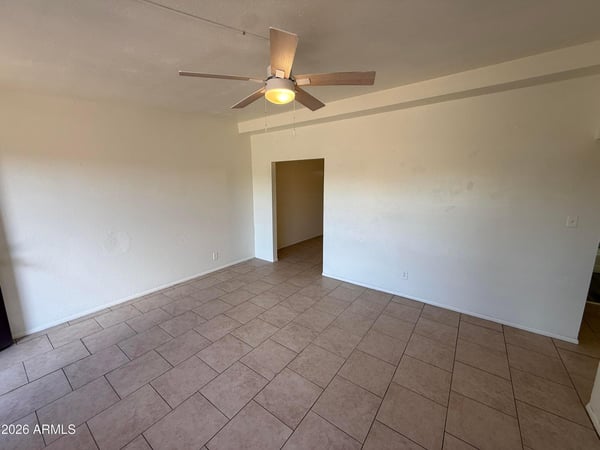 Spacious main living area offering multiple furniture arrangement options, easy-maintenance flooring, and a bright, airy feel. The open layout supports a variety of lifestyle needs and design preferences.