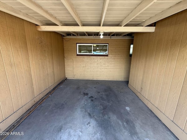 Protected carport parking space designed to provide shade and convenience year-round. This covered parking feature adds value and practicality to everyday living in Phoenix.