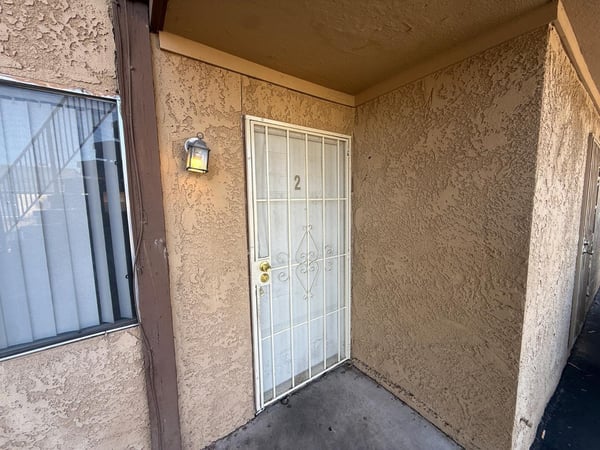 Private covered entry with security door creates a welcoming first impression while providing additional privacy and functionality. A practical feature that enhances everyday living.