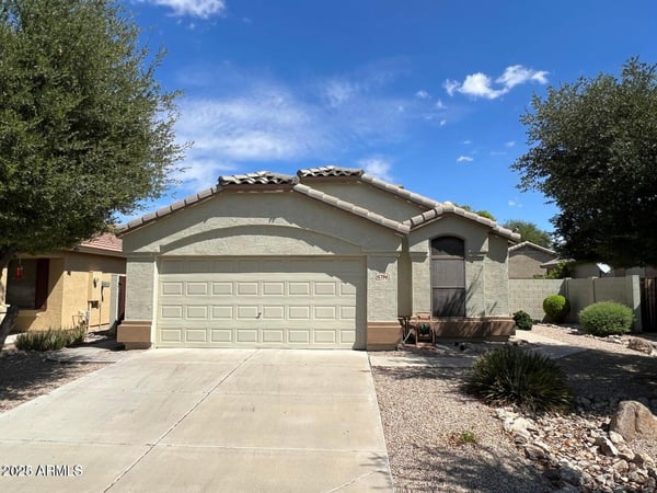 Well-maintained single-level home with a two-car garage, wide driveway, and mature landscaping that enhances curb appeal. The inviting exterior reflects the comfortable lifestyle and convenience offered in this sought-after Goodyear location.