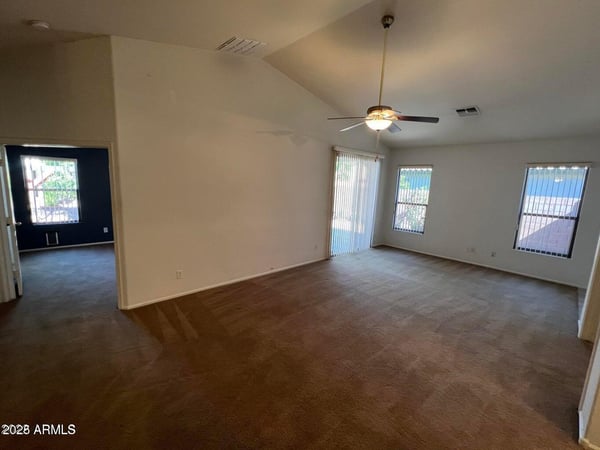 Spacious living area designed for comfort and functionality with abundant natural light and direct backyard access. The seamless layout supports both entertaining and everyday living.