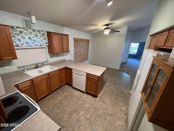 Spacious kitchen with abundant cabinet storage, generous prep areas, and an efficient layout designed for convenience. The open design enhances functionality while maintaining a welcoming atmosphere.