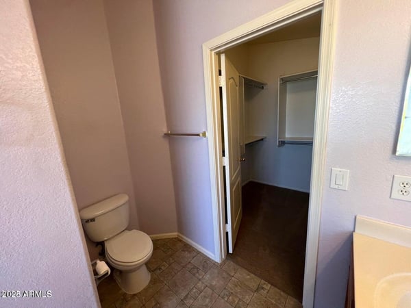 Functional primary bath with convenient access to a spacious walk-in closet. This efficient design enhances organization while providing a seamless owner's suite experience.