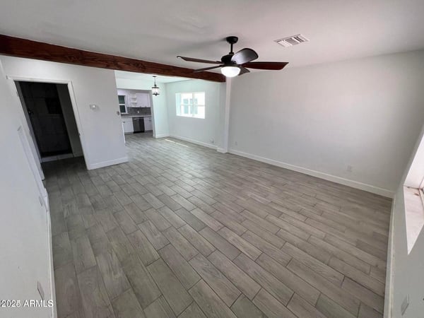 Wide-open living spaces, contemporary tile flooring, and modern finishes create a comfortable environment for entertaining and everyday life. The open layout enhances both functionality and visual appeal.
