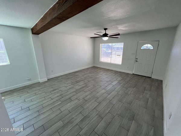 Bright and airy, this living room offers abundant natural light, updated finishes, and a spacious layout. It's an ideal gathering place that connects seamlessly with the rest of the home.