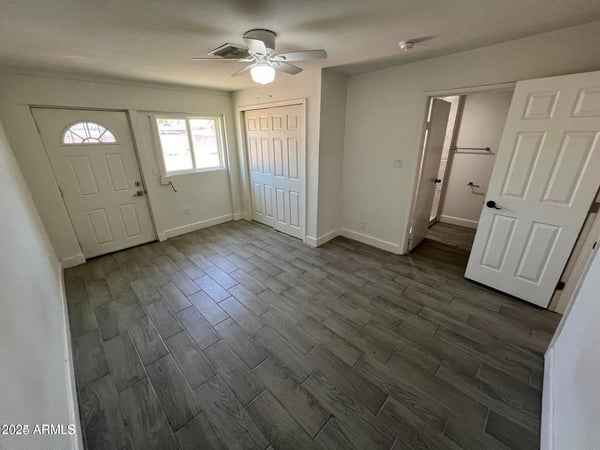 Enjoy a spacious bedroom featuring modern flooring, closet storage, and convenient bathroom access. The clean, updated design complements the home's move-in-ready condition.