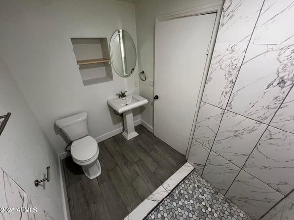 Updated with modern fixtures, attractive tile flooring, and a clean contemporary design, this bathroom offers a functional and inviting space. Recent improvements contribute to the home's fresh, move-in-ready condition.