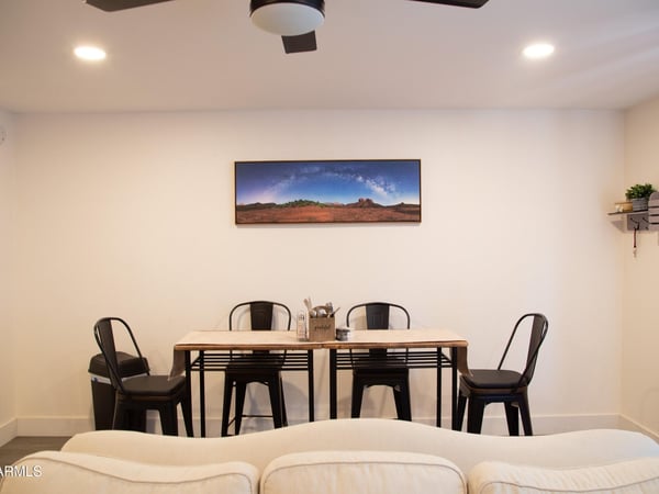 Positioned adjacent to the living area and kitchen, this dining space offers convenience and versatility for daily meals or entertaining guests. Its open placement enhances the overall functionality of the floor plan.