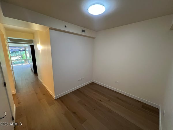Flexible interior space with modern flooring and clean design, ideal for a home office, creative studio, workout area, or additional living space. Adaptable to fit a variety of lifestyle needs.