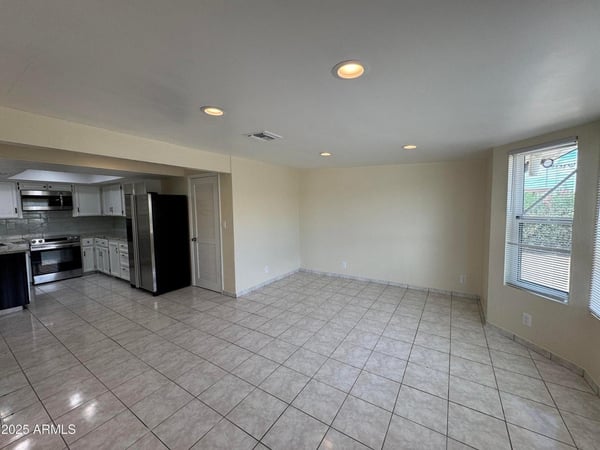 Spacious dining area adjacent to the updated kitchen with ample room for formal or casual dining. Natural light and an open layout enhance the home's flow and functionality.