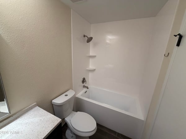 Clean and inviting full bathroom offering a tub and shower combination, updated vanity, and contemporary fixtures. Functional design meets everyday comfort while enhancing the home's move-in-ready appeal.