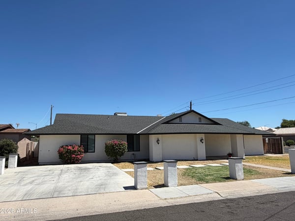 Well-maintained Glendale residence featuring a wide driveway, mature landscaping, and attractive ranch-style architecture. Fresh exterior updates create outstanding curb appeal.