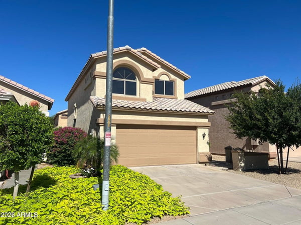 A well-maintained exterior, mature landscaping, and expansive driveway create an inviting first impression. This attractive home offers the perfect blend of style and functionality within a sought-after gated neighborhood.