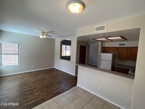 Spacious and inviting, this family room offers abundant natural light, durable flooring, and convenient access to the kitchen. The layout is ideal for movie nights, gatherings, or relaxing after a busy day.