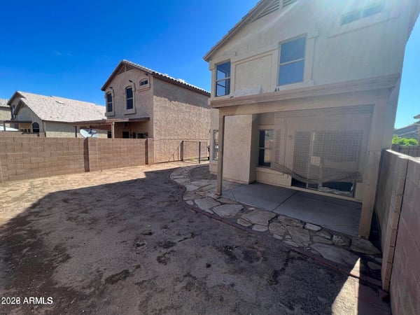 This spacious backyard offers a blank canvas for creating the outdoor retreat you've always wanted. The covered patio, privacy fencing, and generous yard area provide opportunities for recreation, landscaping, and entertaining.