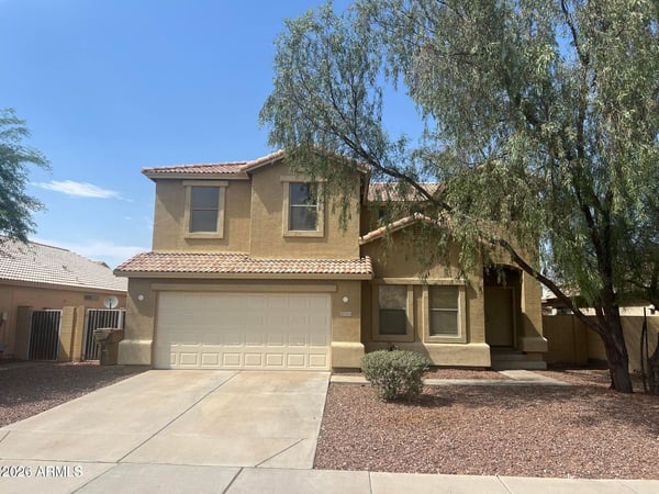 Attractive two-story home featuring an attached two-car garage, mature shade trees, and low-maintenance landscaping. This move-in-ready property offers excellent curb appeal and a desirable location near everyday conveniences.