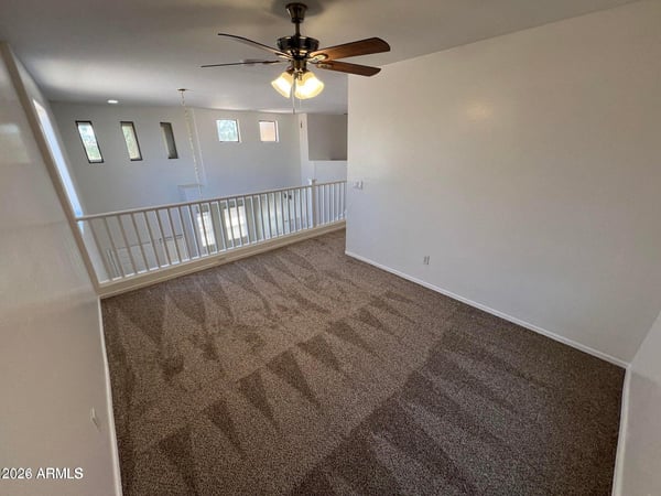 Open loft overlooking the foyer and living spaces below, providing room for a home office, playroom, media center, or additional lounge area.