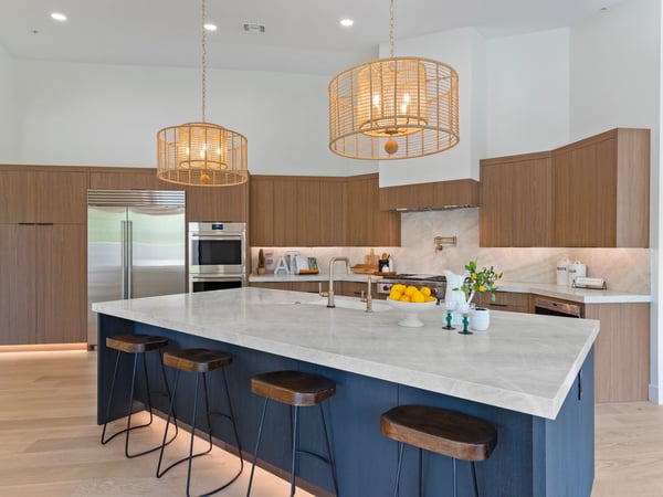 Stylish kitchen featuring an oversized island with seating, premium appliances, custom cabinetry, and elegant finishes. The open-concept layout makes hosting family and friends effortless.